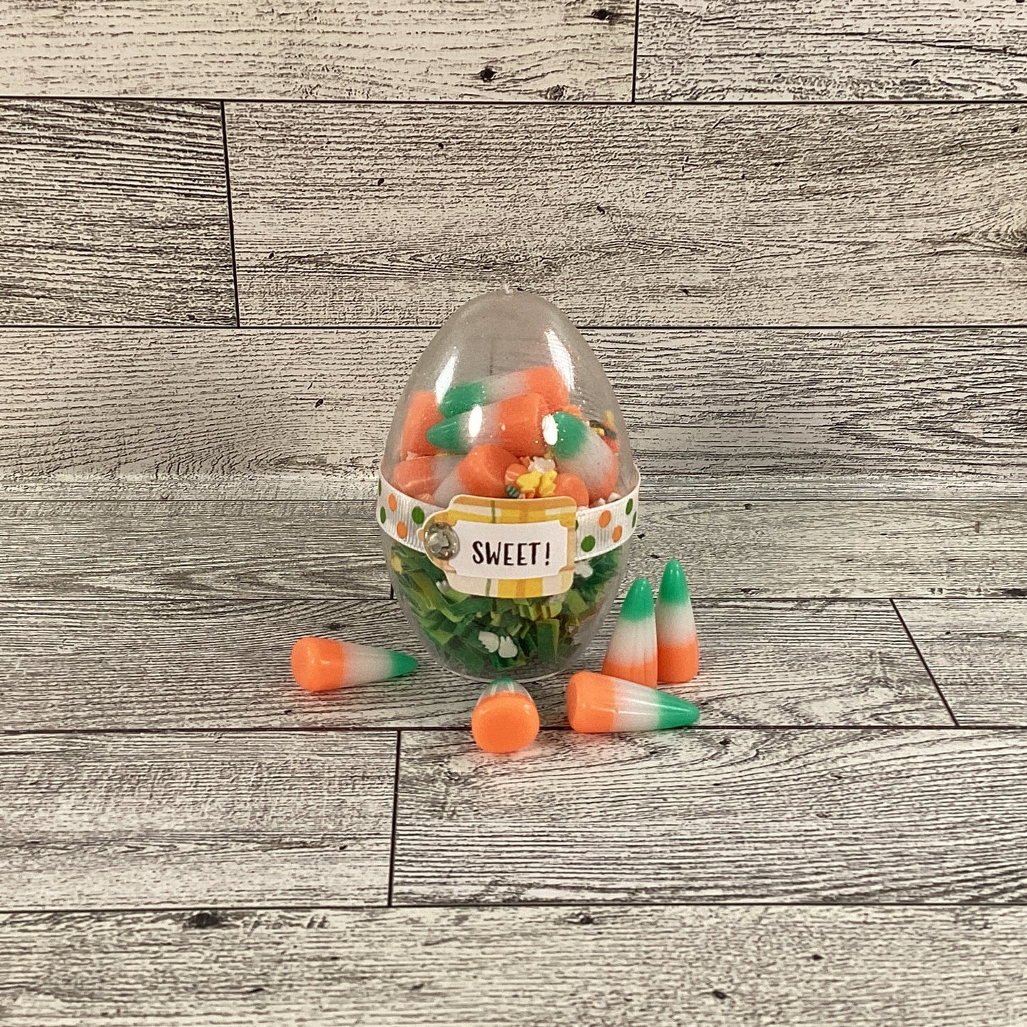 AGD Easter Decor - Clear Egg Filled Fake Candy Corn Carrot Cake Shaker Sitter