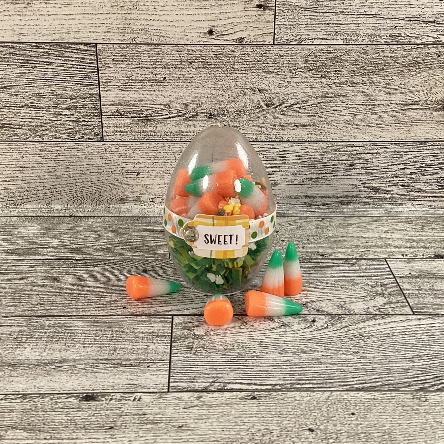 AGD Easter Decor - Clear Egg Filled Fake Candy Corn Carrot Cake Shaker Sitter