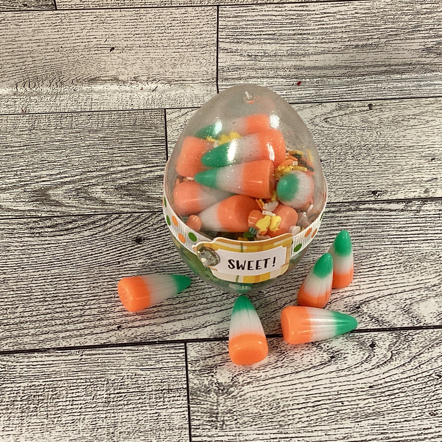 AGD Easter Decor - Clear Egg Filled Fake Candy Corn Carrot Cake Shaker Sitter