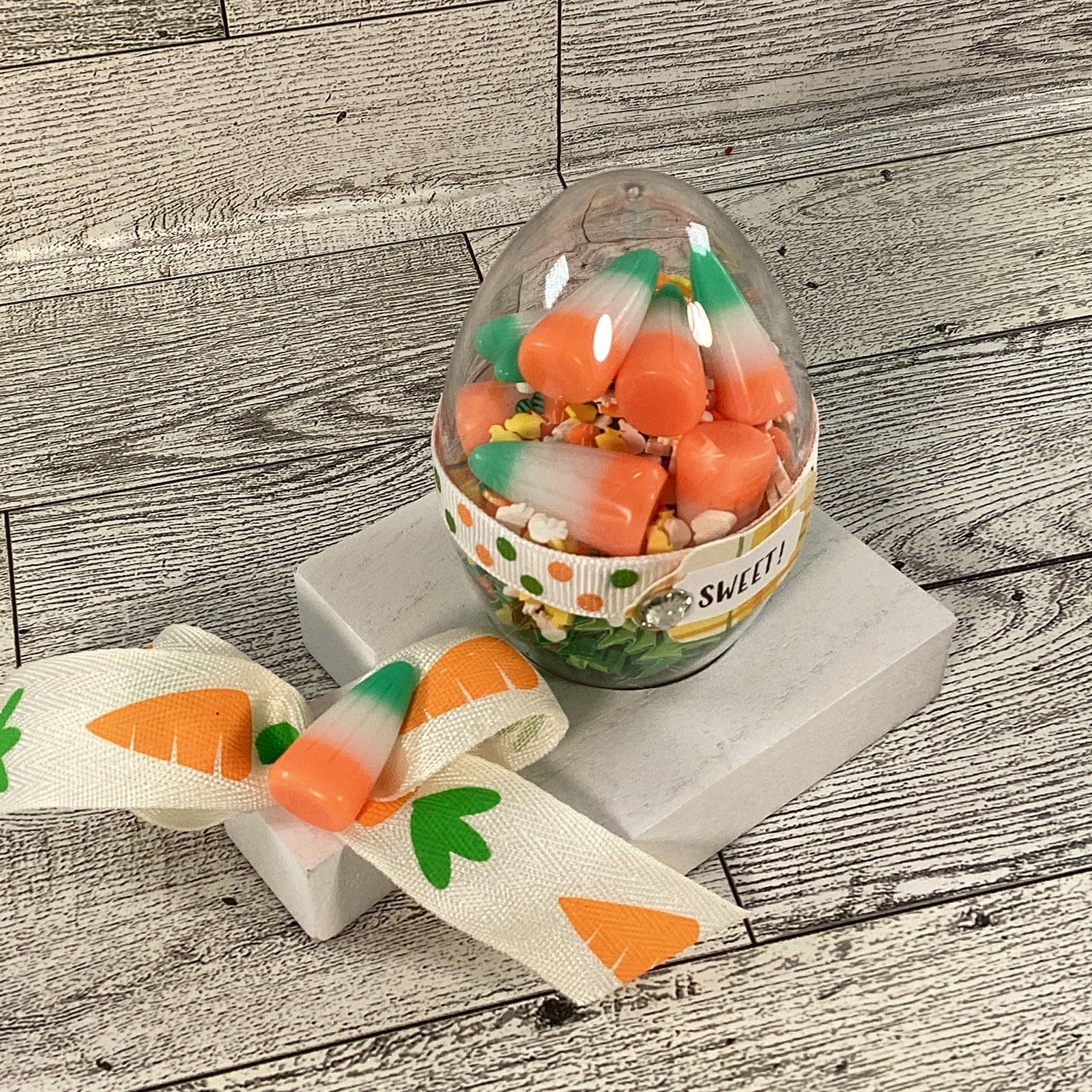 AGD Easter Decor - Clear Egg Filled Fake Candy Corn Shaker Sitter