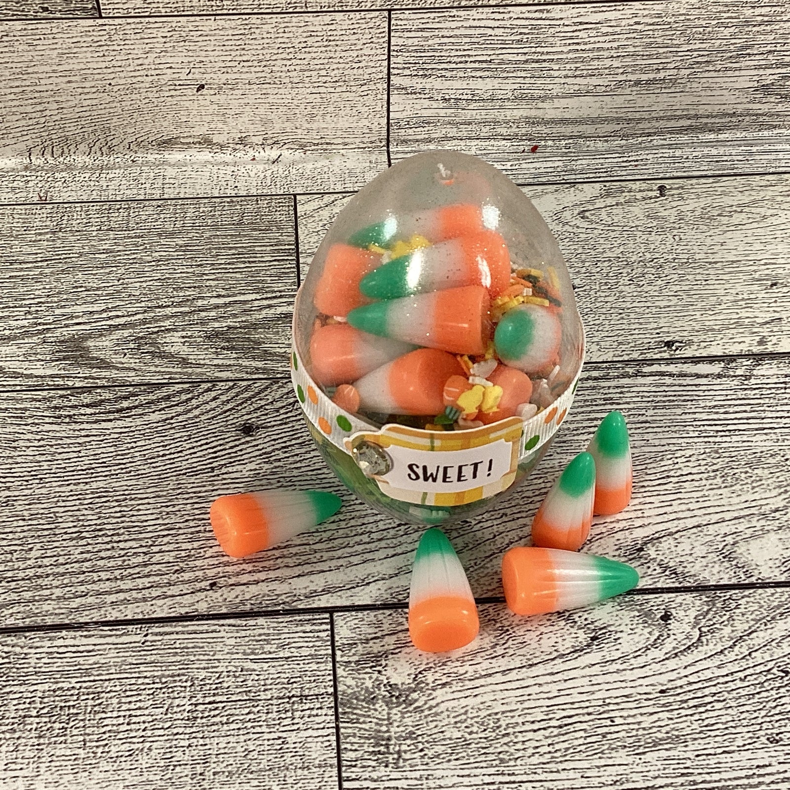 AGD Easter Decor - Clear Egg Filled Fake Candy Corn Carrot Cake Shaker Sitter