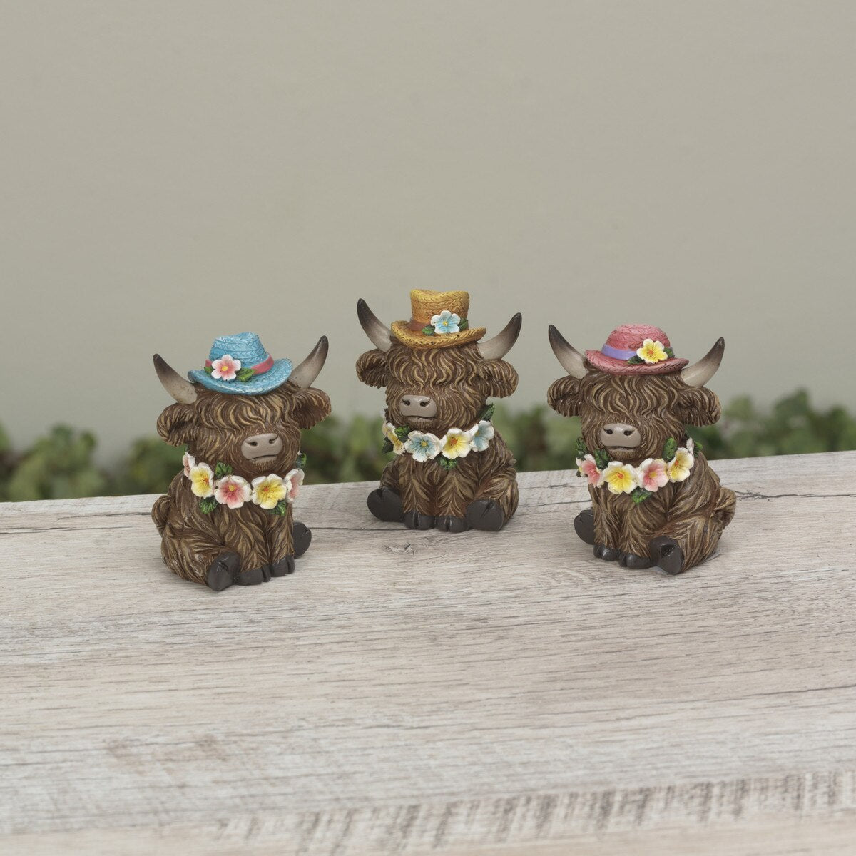 Gerson Spring Decor - Resin Highland Cow Flower Hats Figurines 4pc Set