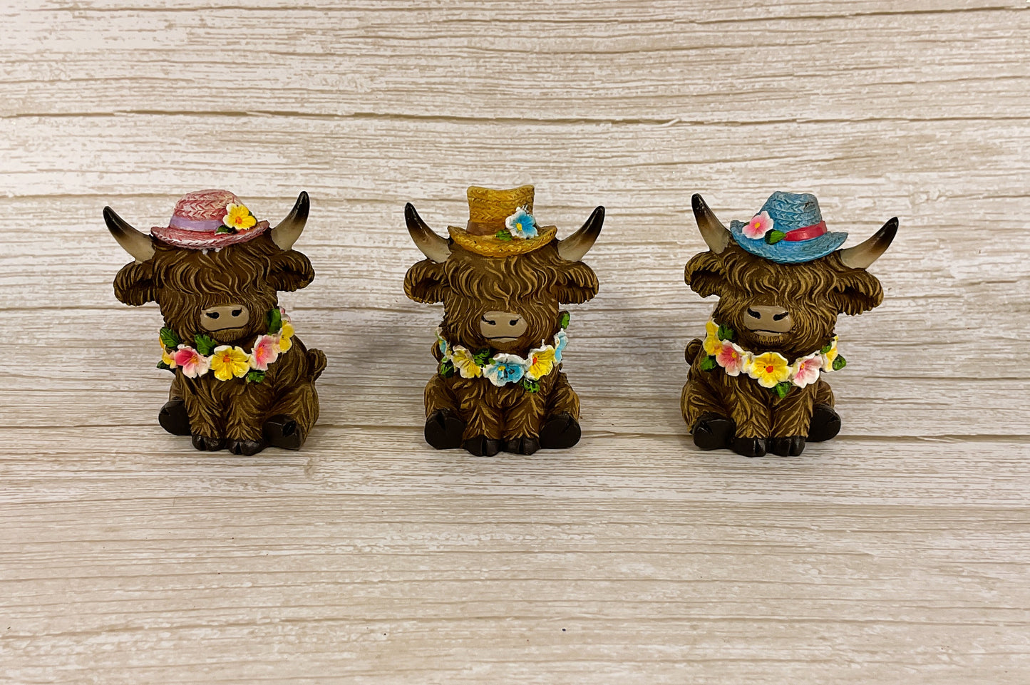 Gerson Spring Decor - Resin Highland Cow Flower Hats Figurines 4pc Set
