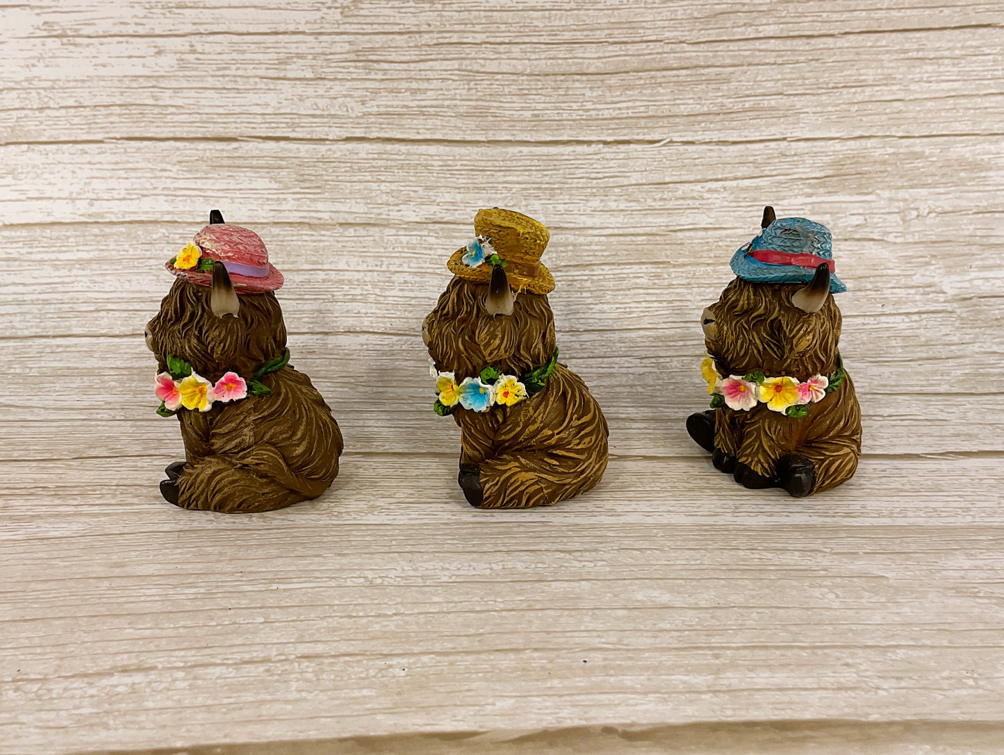 Gerson Spring Decor - Resin Highland Cow Flower Hats Figurines 4pc Set